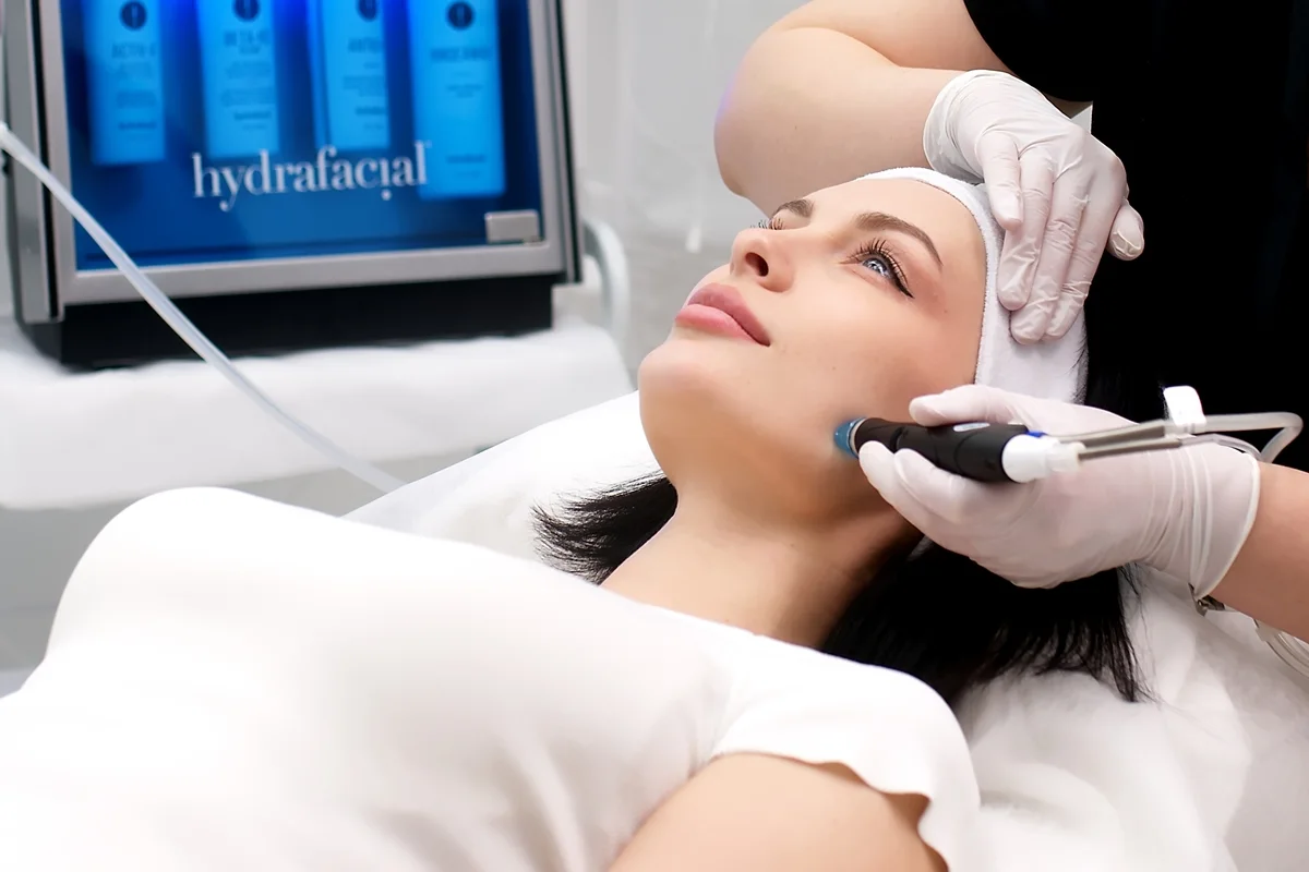 Woman receiving HydraFacial treatment for dry skin in West Palm Beach FL